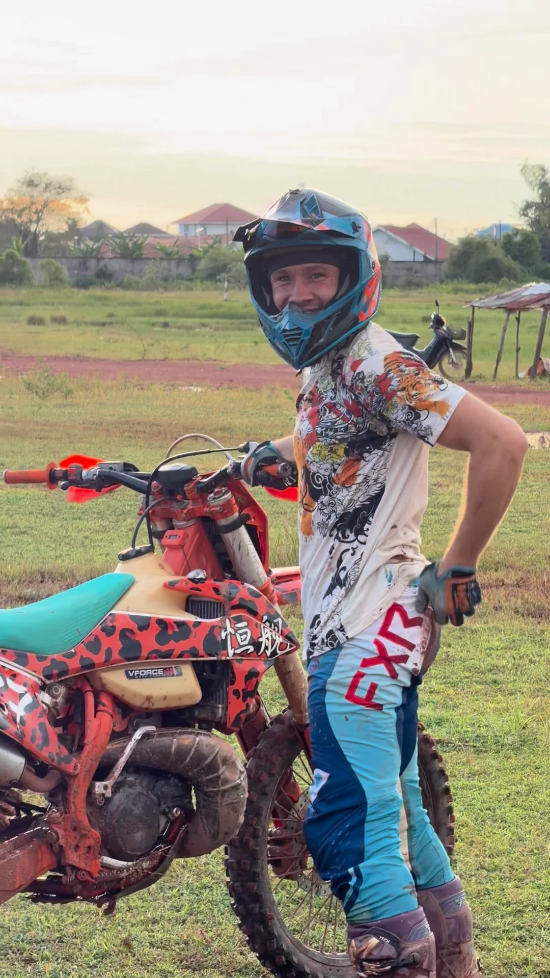 Francis with his motorcycle after a training session in Laos